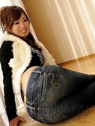 Emiri Seo poses in a room on floor Emiri Seo poses in a room on floor