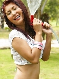 Gorgeous April Lim is having so much fun as nasty camera dude is spraying her with water gun. Gorgeous April Lim is having so much fun as nasty camera dude is spraying her with water gun.