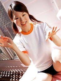 Naoko Sawano in sports outfit plays with balls in garden Naoko Sawano in sports outfit plays with balls in garden